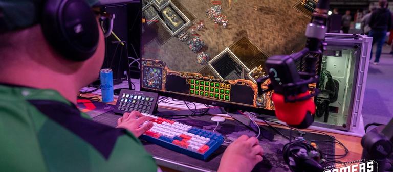 Person playing Starcraft II on their PC at the Gamers for Giving LAN.